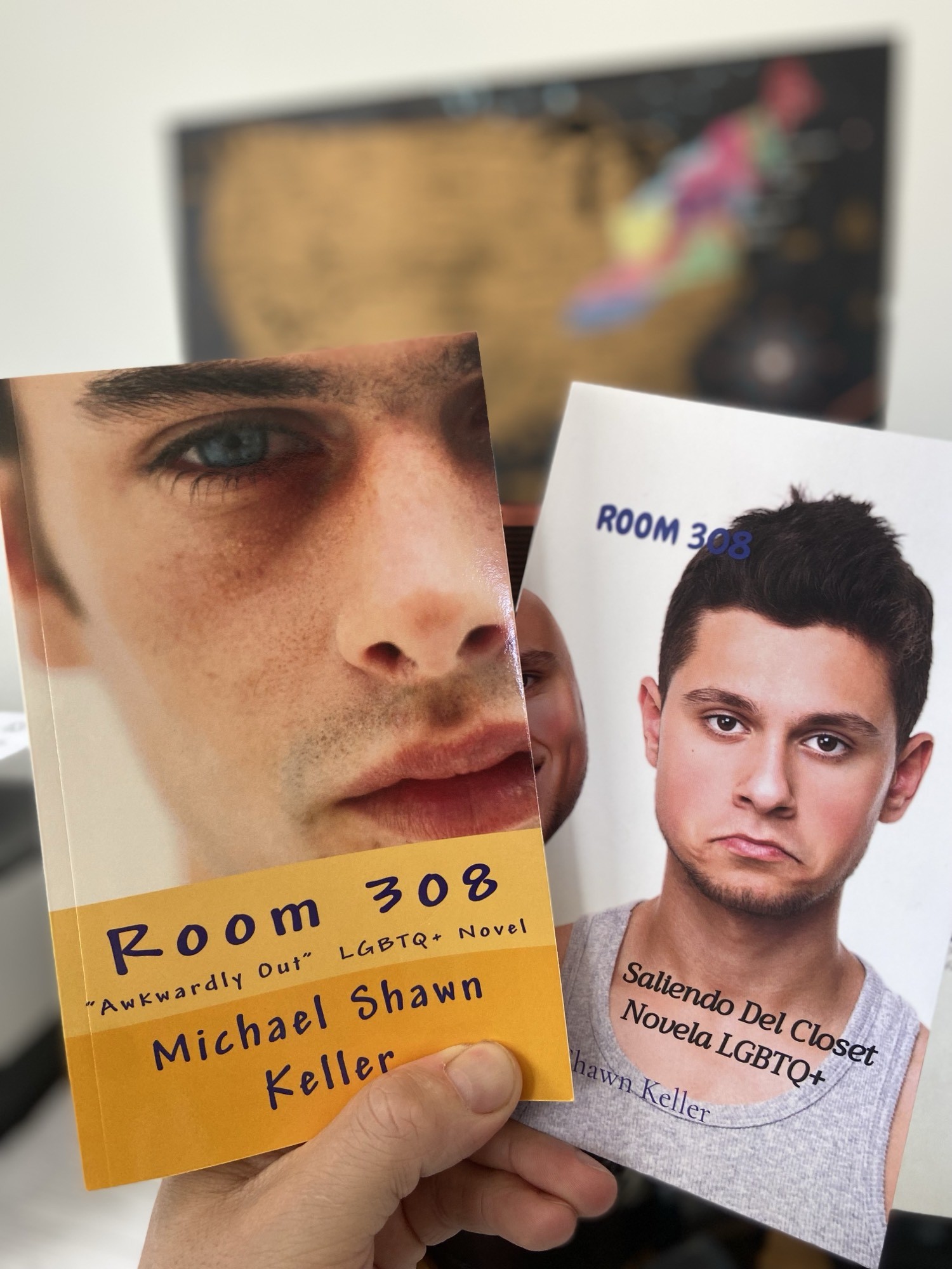 Mike holding the English and Spanish editions of Room 308